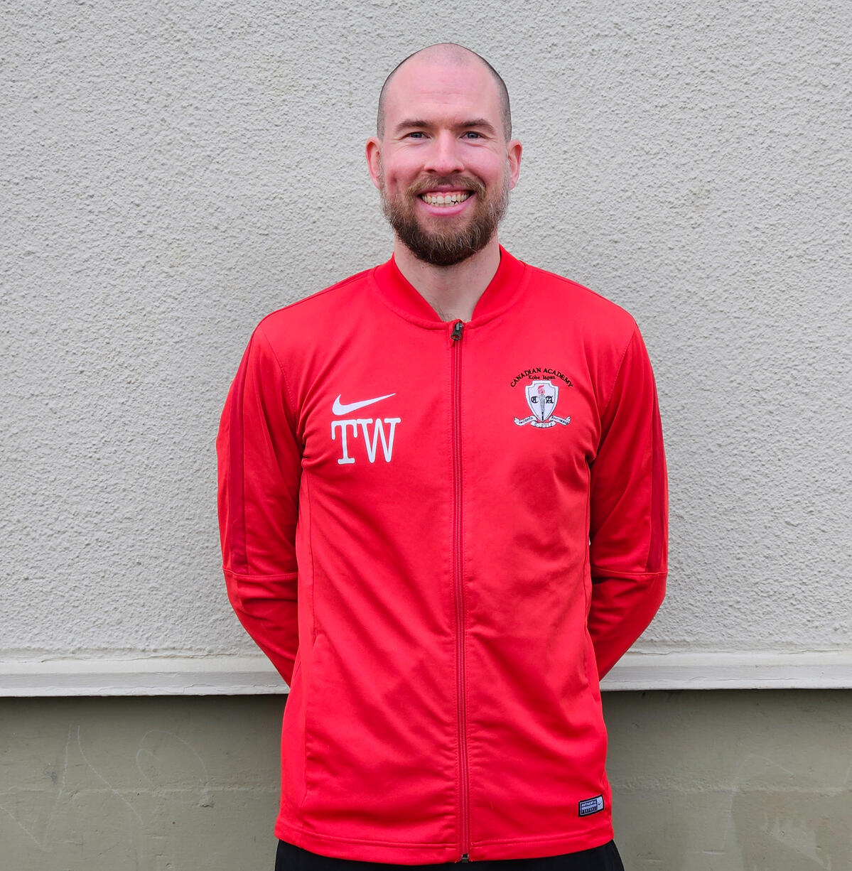 Soccer coach headshot - Passionate and skilled trainer dedicated to elevating players' abilities and fostering a love for the beautiful game.