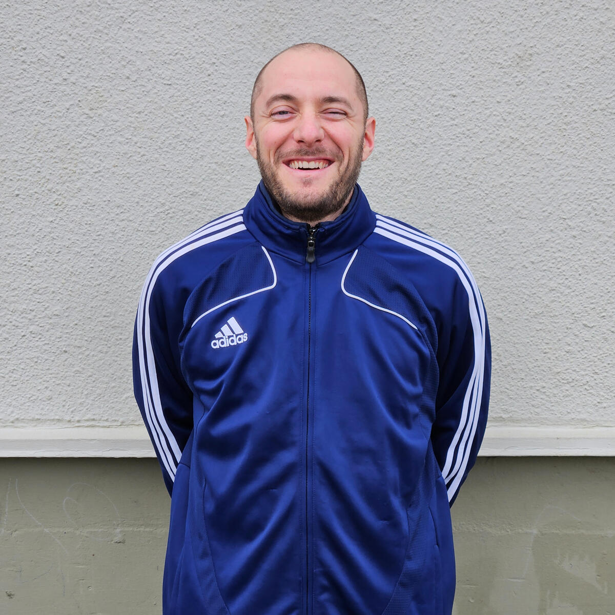 Professional soccer coach headshot - Experienced and dedicated trainer committed to enhancing players' skills and fostering a passion for the game.